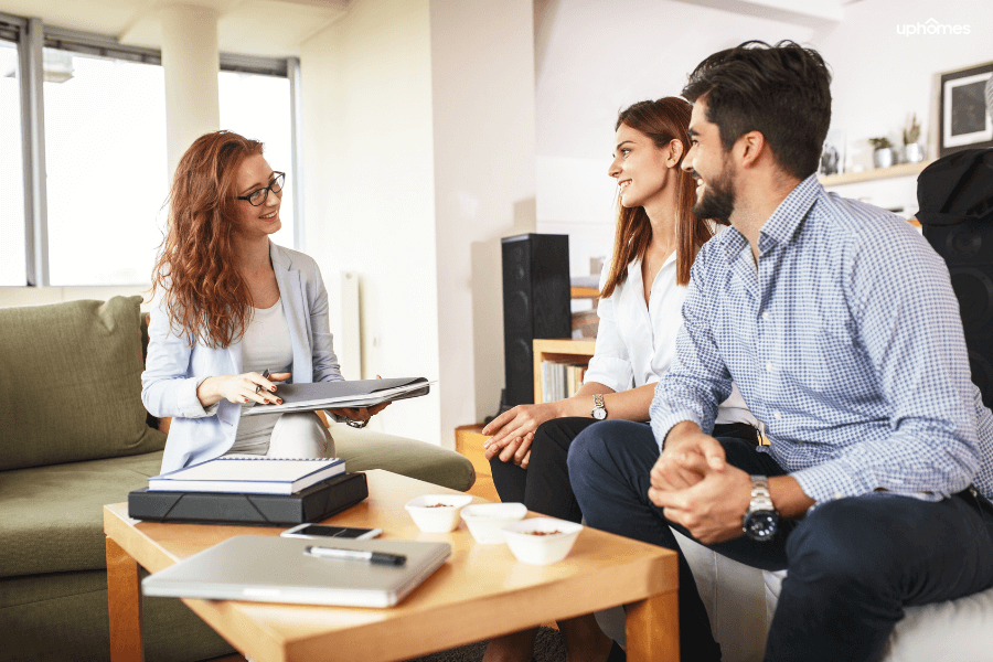 A Real Estate Attorney who is closing on the property with her home buyers in their new home