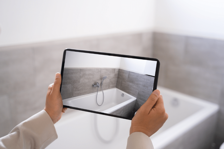 Virtual-Tour-Bathroom.png Virtual tour on a tablet in a bathroom with a white tub and tile