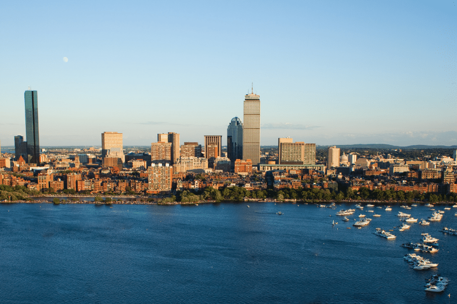 Boston-Back-Bay.png Boston's back bay aerial view of the city with boats in the water