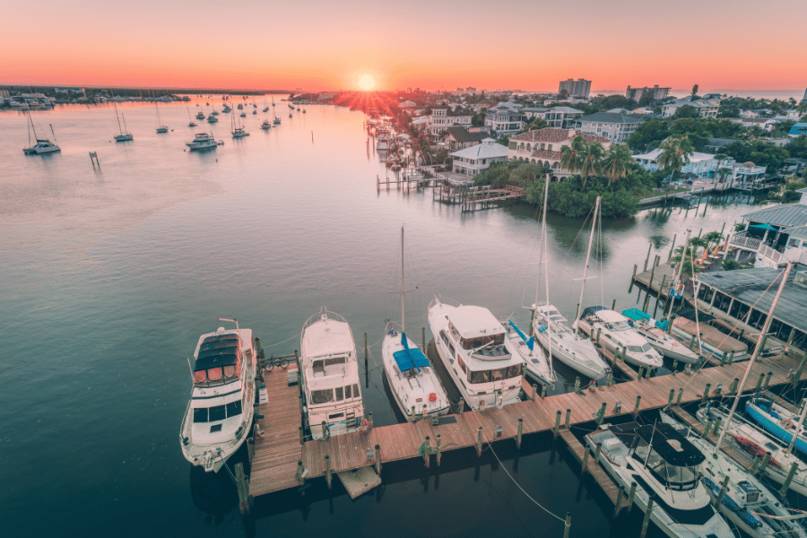 Fort Myers, FL orange sunset near the water with boats