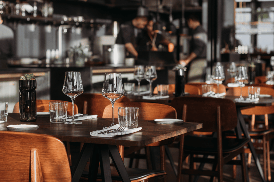 Restaurant with wine glasses and tables 