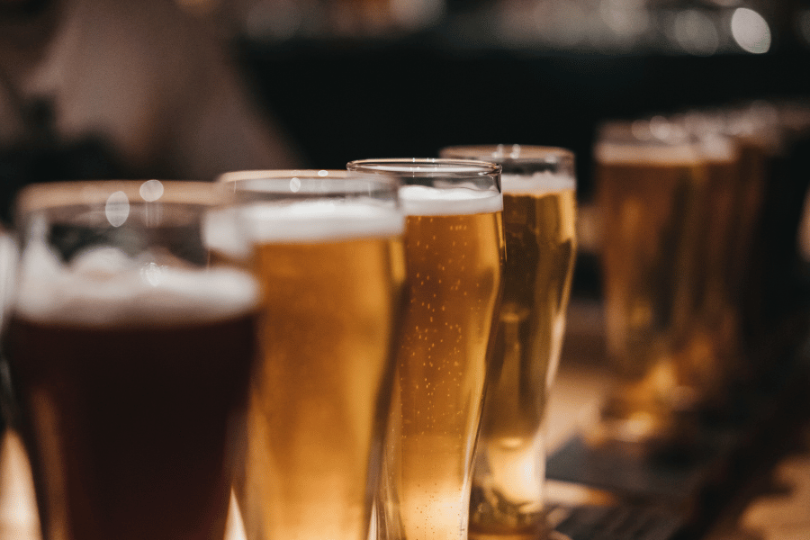 Beer in glasses Glasses of beer lined up on a table