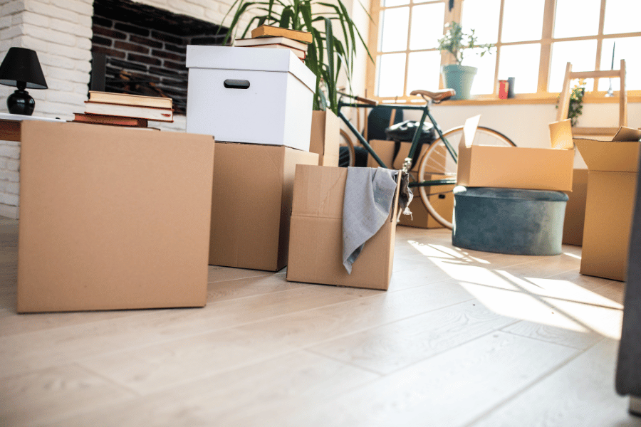 unpacking moving boxes in living room 