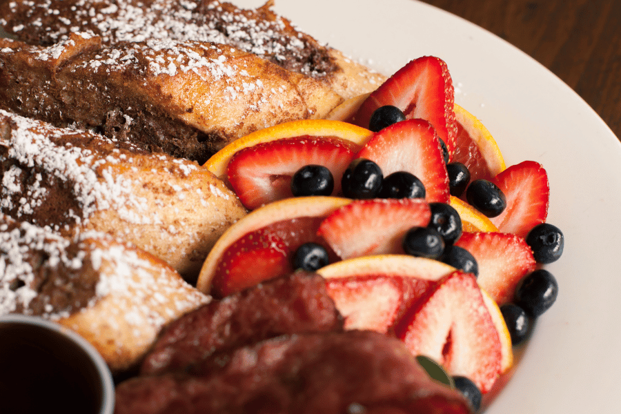 Brunch food Brunch with fruit, french toast, and bacon