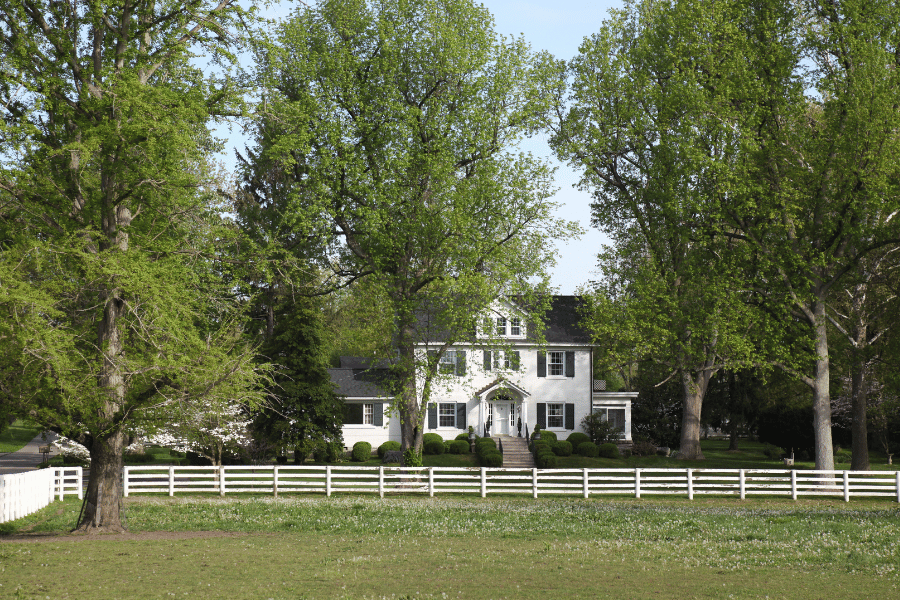 real-estate-lexington-ky.png Big white house in big green field in Lexington KY