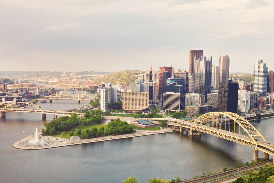 Ariel photo of Pittsburgh showcasing downtown, point park, and the river