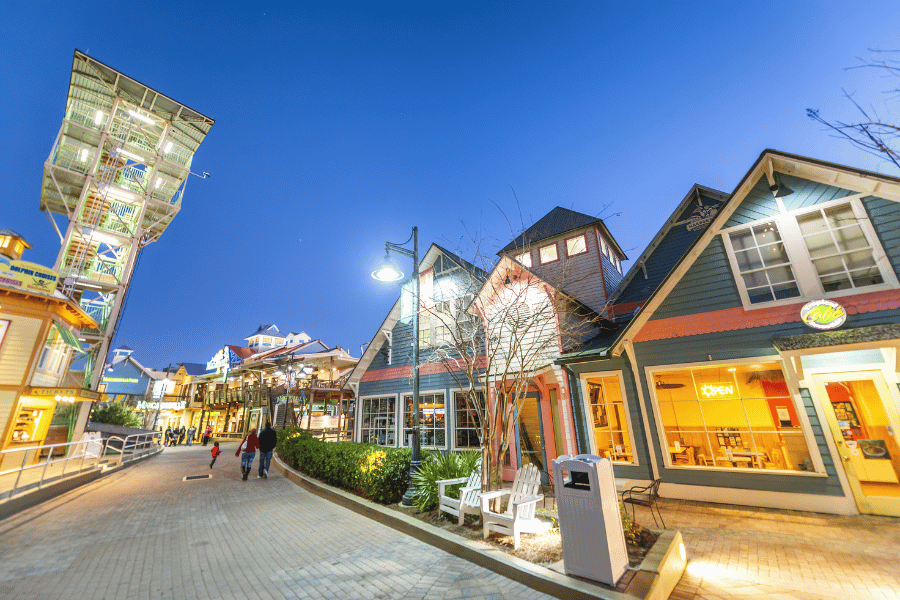 Destin Harbor Boardwalk at dusk with people walking