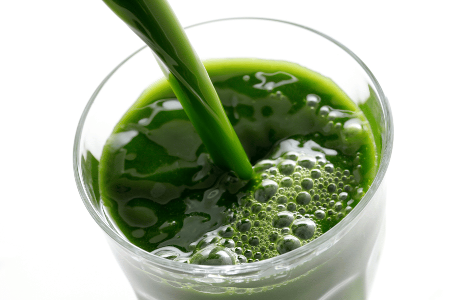 Green Juice Green juice poured into a glass
