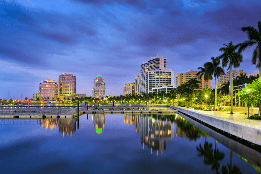Night near the water in West Palm Beach, FL with palm trees