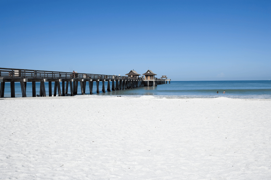 Naples Pier Beach Naples Pier Beach on a sunny day with white sand