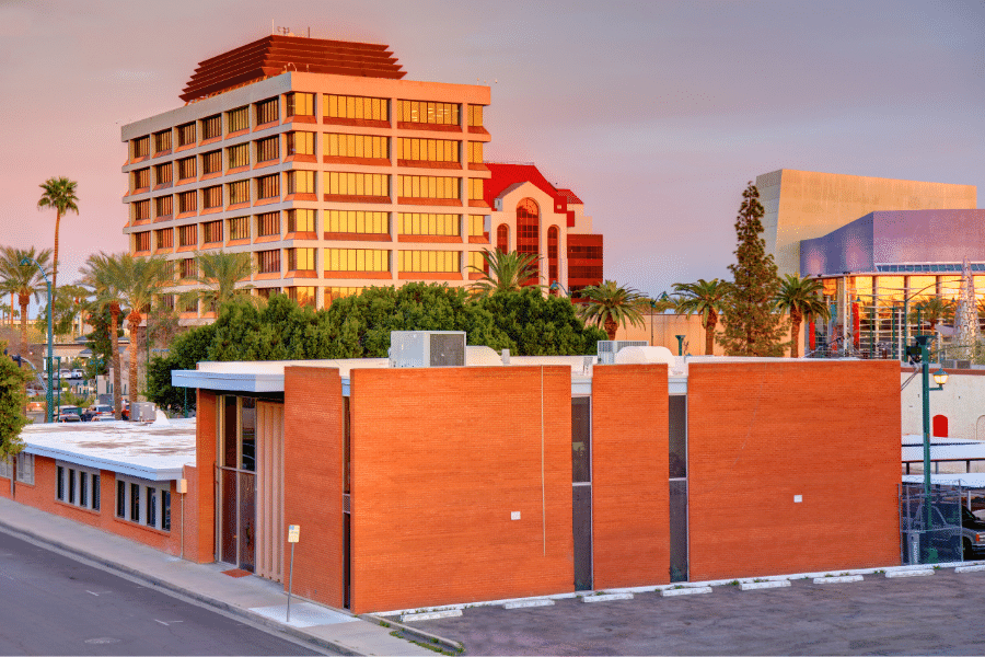 Buildings-and-Sunset-Mesa-AZ.png City buildings and palm trees with pretty sunset in Mesa, Arizona