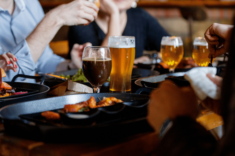 Friends enjoying craft beer and pub grub in Tempe, Arizona