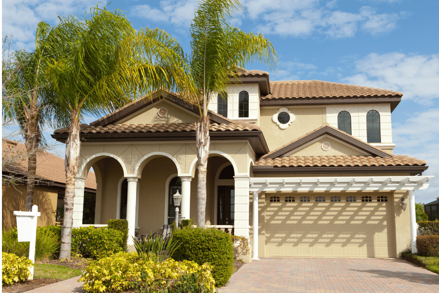 Amazing home for sale in Pensacola, FL with palm tree in the front yard