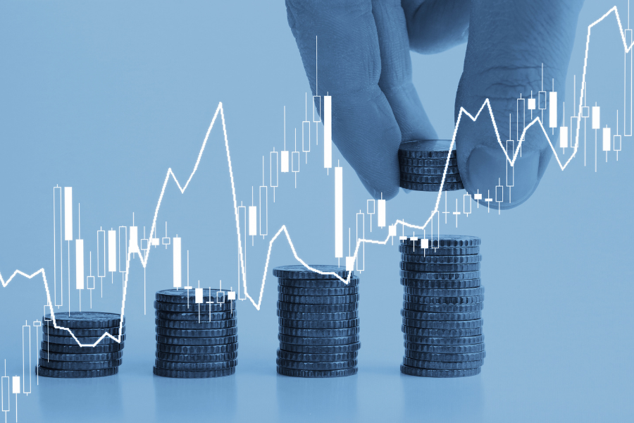 Investment.png Coins increasing in value on a blue background