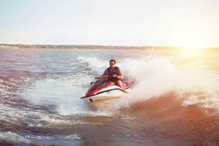 jetski Image of a middle aged man on a jetski with crystal clear blue waters