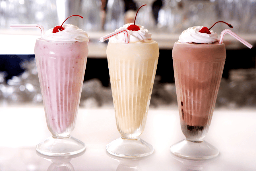 Milkshakes three milkshakes strawberry vanilla and chocolate