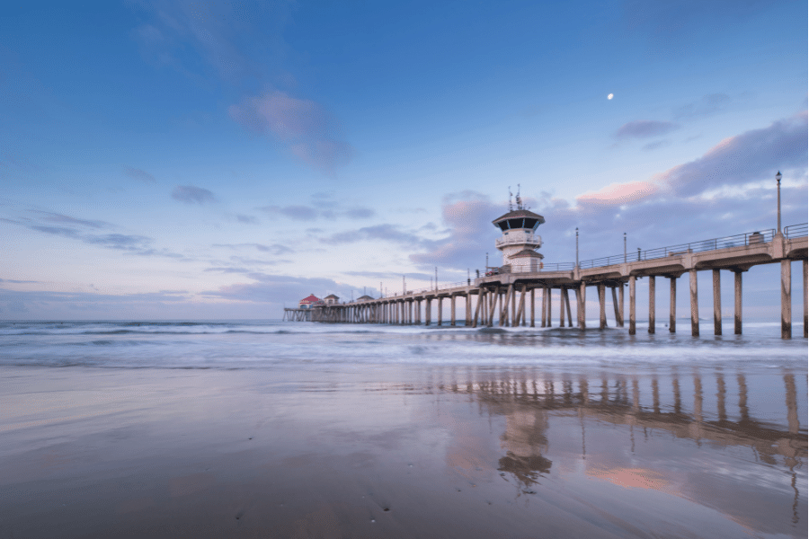 Huntington Beach Huntington Beach sunset and moon in the sky near the pier