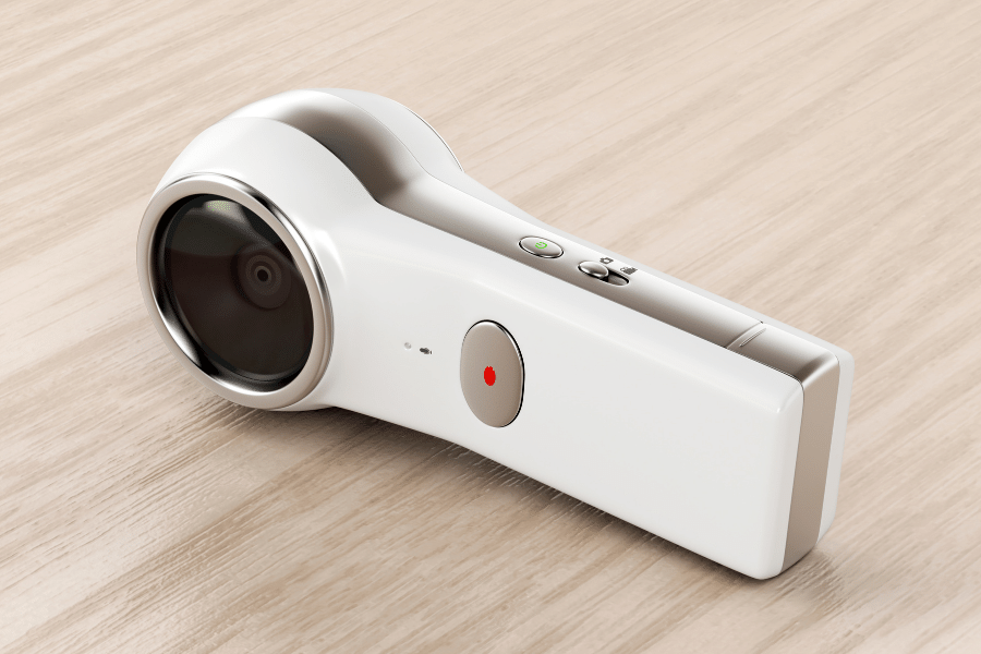 360-degree-camera.png white 360-degree camera on wooden background