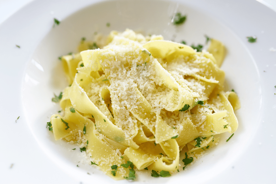 Fettuccine Alfredo Fettuccine Alfredo dish in a bowl with parmesan cheese