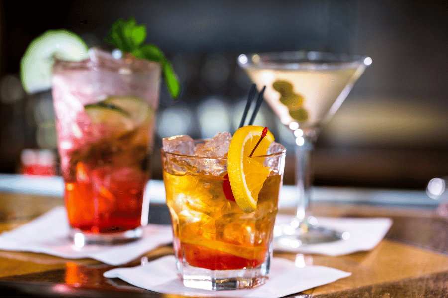 Craft-cocktails.png three craft cocktails on napkins