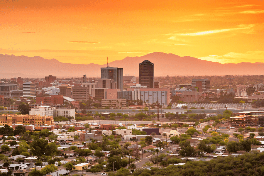 Tucson-Arizona-Sunset-City-View.png Beautiful city view of Tucson, Arizona during the sunset with an orange glow