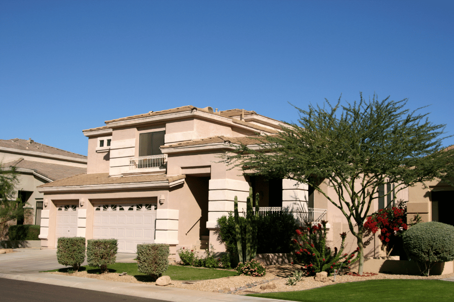 Phoenix-AZ-real-estate.png home in Phoenix, AZ with pretty landscaping and a clear blue sky