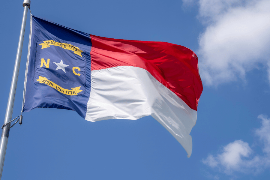 NC State Flag flying on the pole