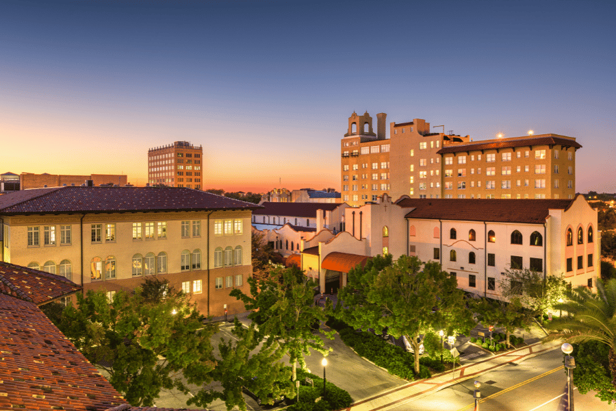 Downtown Lakeland, FL at dusk with palm trees and buildings
