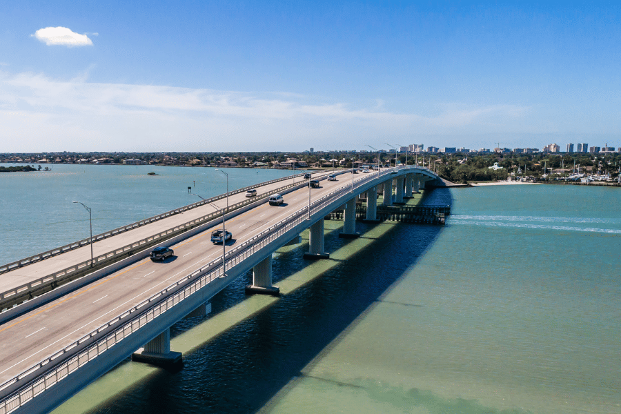 Marco island bridge Cars driving over the Marco Island bridge on a beautiful sunny day