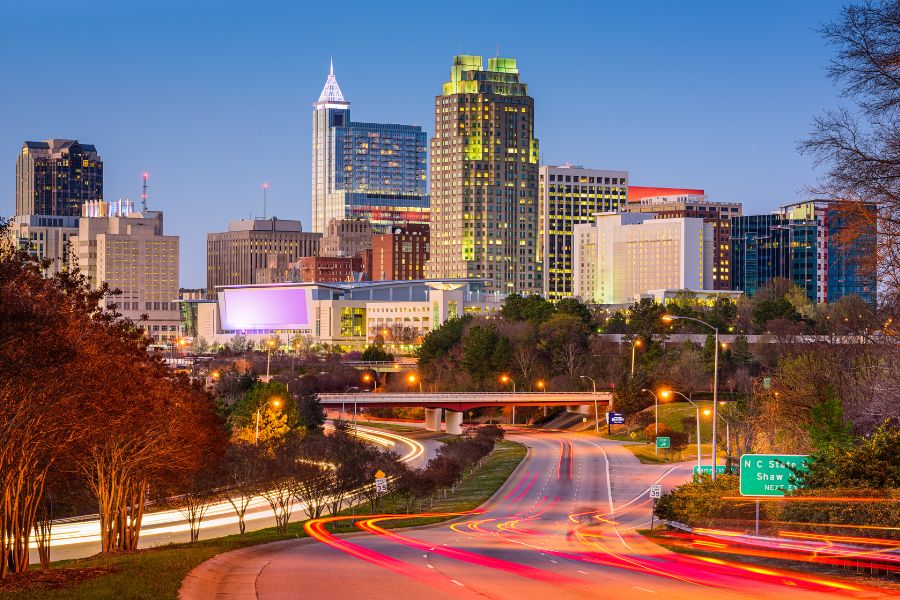 Raleigh, NC skyline at night with car and building lights